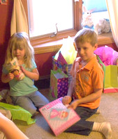 Adissen and Matthew opening gifts